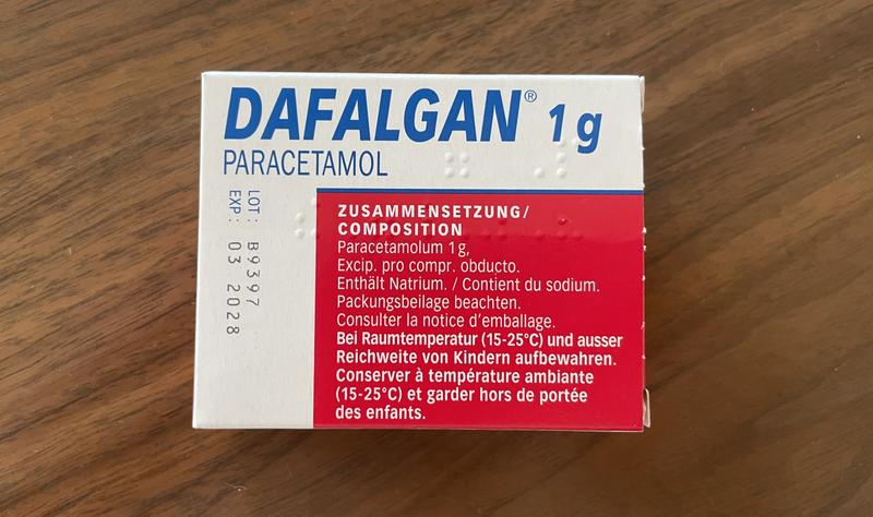 Verpakking van Dafalgan 1g paracetamol met samenstellingsinformatie in het Duits en Frans.